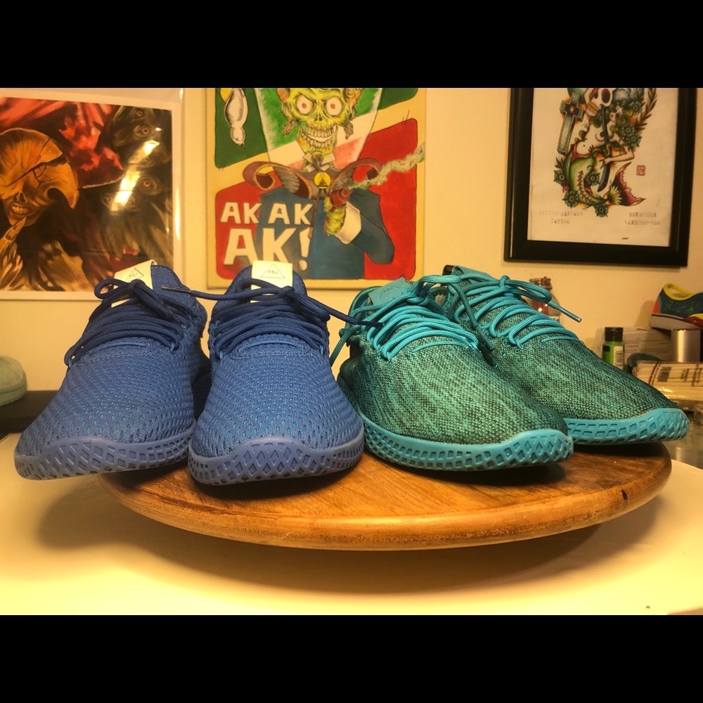 Two pairs of adidas Pharrells blue and teal